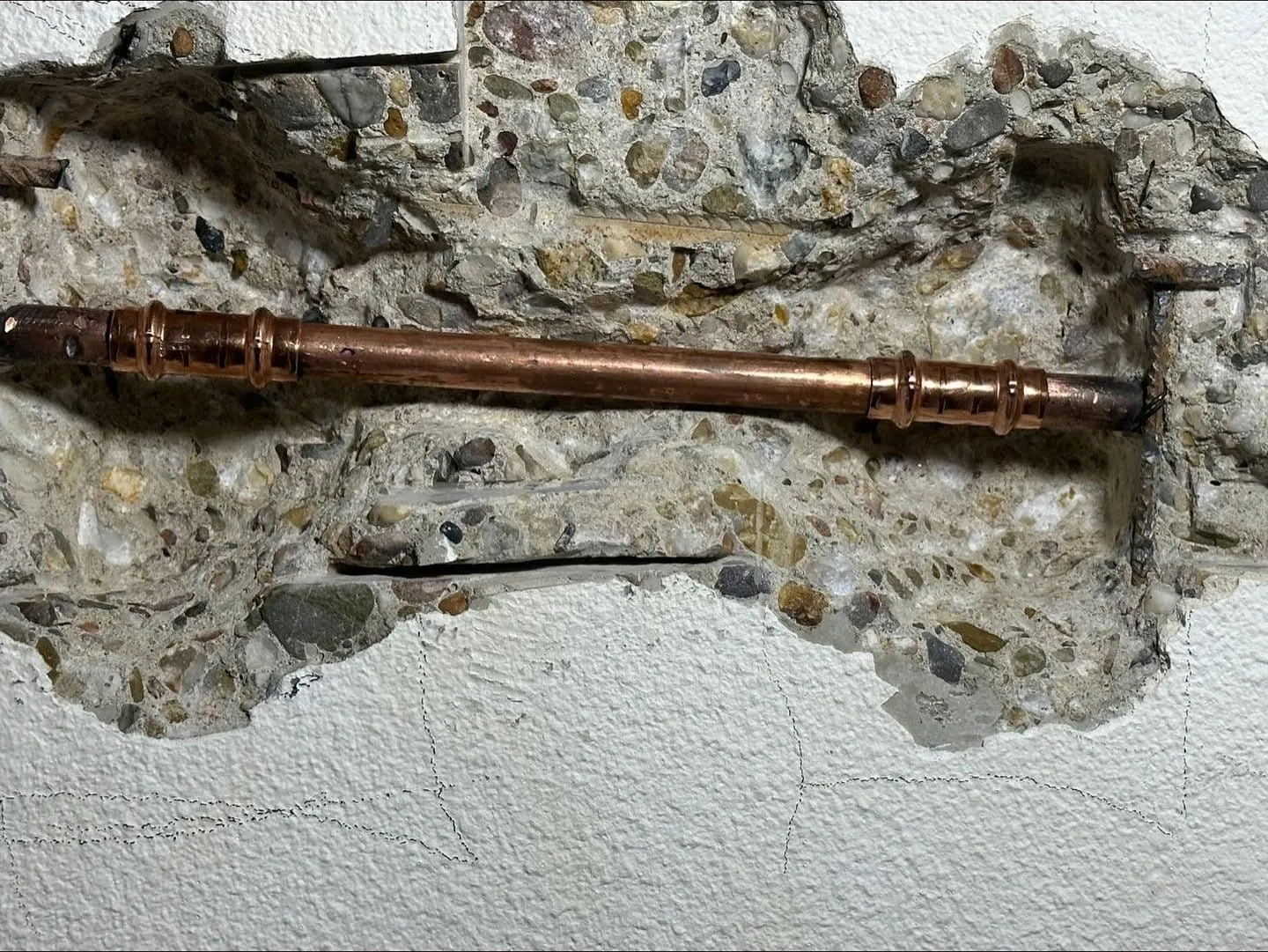 Copper water pipe in a wall that has been opened up